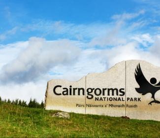 Cairngorms National Park sign on hillside