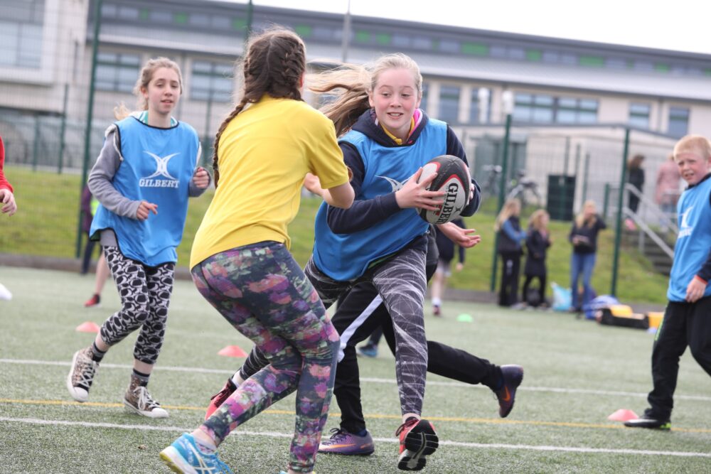 Girls plying rugby