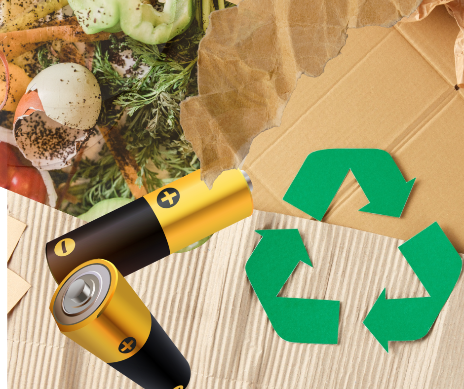 Close-up of used batteries, food scraps, and torn cardboard with a green recycling symbol on corrugated paper, highlighting waste separation.