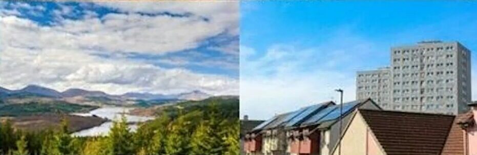 Residential houses with solar panels on rooftops and a tall apartment building in the background against a clear blue sky and a scenic view of a river winding through a forested valley with mountains in the distance under a partly cloudy sky,
